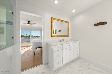 Panoramic lake and golf course views from this elegant island on The Dunes Golf and Tennis Club in Florida - for sale on GolfHomes.com, golf home, golf lot