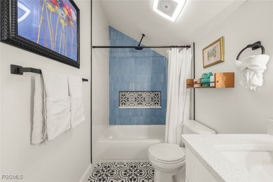 Panoramic lake and golf course views from this elegant island on The Dunes Golf and Tennis Club in Florida - for sale on GolfHomes.com, golf home, golf lot