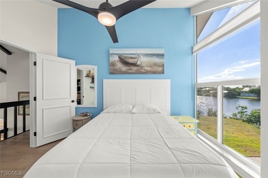 Panoramic lake and golf course views from this elegant island on The Dunes Golf and Tennis Club in Florida - for sale on GolfHomes.com, golf home, golf lot