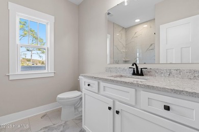 Golf and pond front new construction home is move-in ready in on Lockwood Folly Country Club in North Carolina - for sale on GolfHomes.com, golf home, golf lot