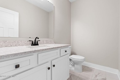 Golf and pond front new construction home is move-in ready in on Lockwood Folly Country Club in North Carolina - for sale on GolfHomes.com, golf home, golf lot