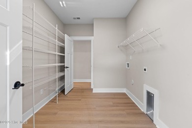 Golf and pond front new construction home is move-in ready in on Lockwood Folly Country Club in North Carolina - for sale on GolfHomes.com, golf home, golf lot