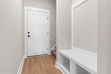 Golf and pond front new construction home is move-in ready in on Lockwood Folly Country Club in North Carolina - for sale on GolfHomes.com, golf home, golf lot