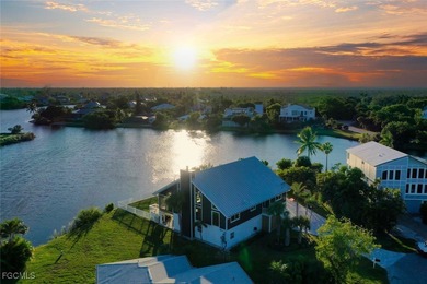 Panoramic lake and golf course views from this elegant island on The Dunes Golf and Tennis Club in Florida - for sale on GolfHomes.com, golf home, golf lot