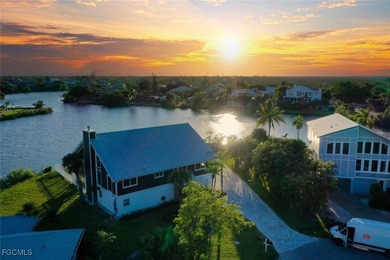 Panoramic lake and golf course views from this elegant island on The Dunes Golf and Tennis Club in Florida - for sale on GolfHomes.com, golf home, golf lot