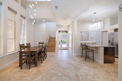 Beautifully updated with idyllic views of the fifteenth hole on Emerald Bay Golf Club in Florida - for sale on GolfHomes.com, golf home, golf lot