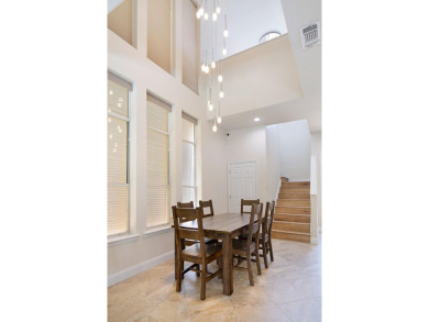 Beautifully updated with idyllic views of the fifteenth hole on Emerald Bay Golf Club in Florida - for sale on GolfHomes.com, golf home, golf lot