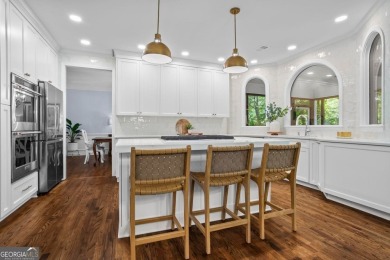 Nestled in the heart of Alpharetta this renovated home in on The Golf Club of Georgia in Georgia - for sale on GolfHomes.com, golf home, golf lot