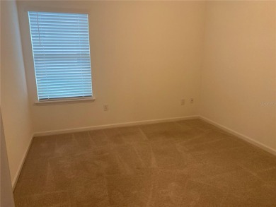 Step into modern comfort in this stunning 3-bedroom, 2-bathroom on Candler Hills Golf and Country Club in Florida - for sale on GolfHomes.com, golf home, golf lot