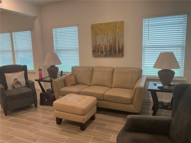 Step into modern comfort in this stunning 3-bedroom, 2-bathroom on Candler Hills Golf and Country Club in Florida - for sale on GolfHomes.com, golf home, golf lot