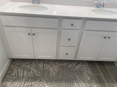 Step into modern comfort in this stunning 3-bedroom, 2-bathroom on Candler Hills Golf and Country Club in Florida - for sale on GolfHomes.com, golf home, golf lot