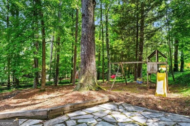 Nestled in the heart of Alpharetta this renovated home in on The Golf Club of Georgia in Georgia - for sale on GolfHomes.com, golf home, golf lot