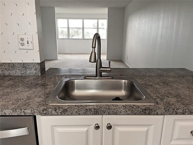 CHARMING 2 bed/ 2 bath, 3RD FLOOR LAKE FRONT CONDO located in on Sunrise Lakes Phase IV Golf Course in Florida - for sale on GolfHomes.com, golf home, golf lot