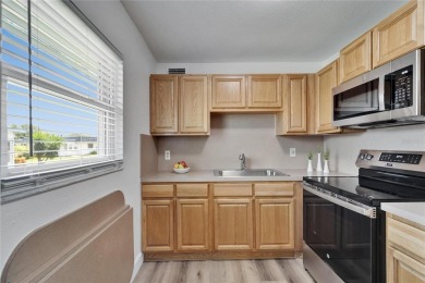 This move-in-ready gem welcomes you with beautiful luxury vinyl on Kings Point Executive Golf Course in Florida - for sale on GolfHomes.com, golf home, golf lot
