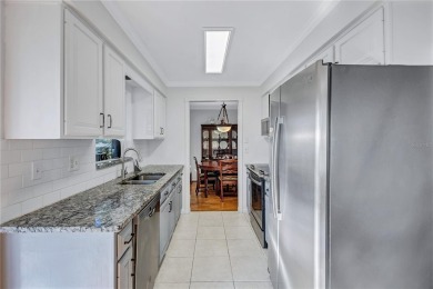 This elegant home features stunning hardwood floors throughout on Highland Lakes Executive Golf Course in Florida - for sale on GolfHomes.com, golf home, golf lot