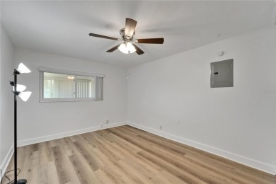 This move-in-ready gem welcomes you with beautiful luxury vinyl on Kings Point Executive Golf Course in Florida - for sale on GolfHomes.com, golf home, golf lot