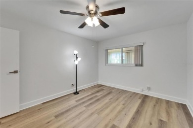 This move-in-ready gem welcomes you with beautiful luxury vinyl on Kings Point Executive Golf Course in Florida - for sale on GolfHomes.com, golf home, golf lot
