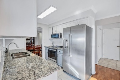 This elegant home features stunning hardwood floors throughout on Highland Lakes Executive Golf Course in Florida - for sale on GolfHomes.com, golf home, golf lot