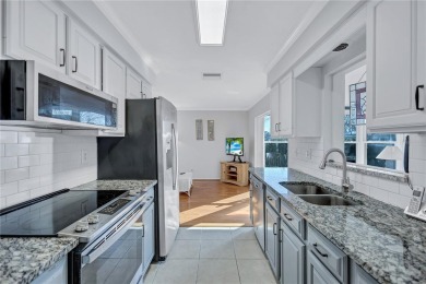 This elegant home features stunning hardwood floors throughout on Highland Lakes Executive Golf Course in Florida - for sale on GolfHomes.com, golf home, golf lot
