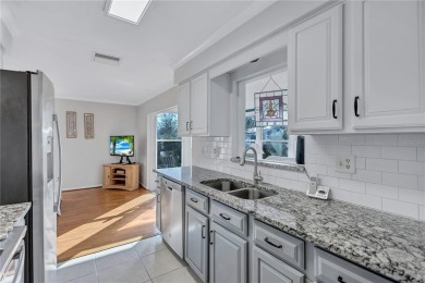 This elegant home features stunning hardwood floors throughout on Highland Lakes Executive Golf Course in Florida - for sale on GolfHomes.com, golf home, golf lot