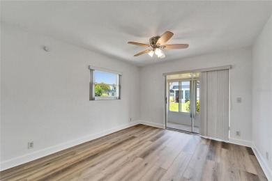 This move-in-ready gem welcomes you with beautiful luxury vinyl on Kings Point Executive Golf Course in Florida - for sale on GolfHomes.com, golf home, golf lot