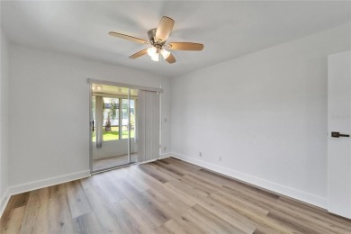 This move-in-ready gem welcomes you with beautiful luxury vinyl on Kings Point Executive Golf Course in Florida - for sale on GolfHomes.com, golf home, golf lot