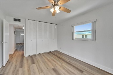 This move-in-ready gem welcomes you with beautiful luxury vinyl on Kings Point Executive Golf Course in Florida - for sale on GolfHomes.com, golf home, golf lot