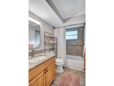 This elegant home features stunning hardwood floors throughout on Highland Lakes Executive Golf Course in Florida - for sale on GolfHomes.com, golf home, golf lot