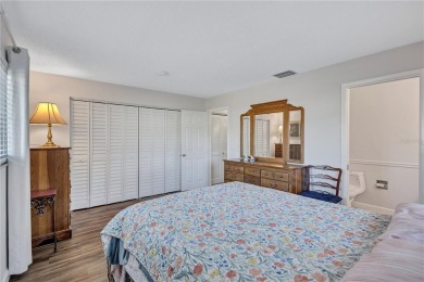 This elegant home features stunning hardwood floors throughout on Highland Lakes Executive Golf Course in Florida - for sale on GolfHomes.com, golf home, golf lot