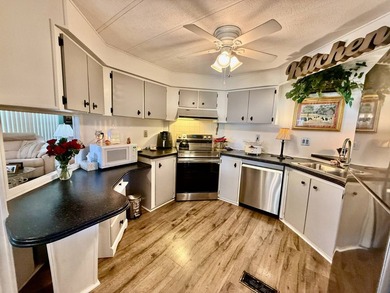 Home is located in Water Oak Country Club Estates, an active 55 on Water Oak Country Club Estates in Florida - for sale on GolfHomes.com, golf home, golf lot