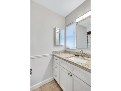 This elegant home features stunning hardwood floors throughout on Highland Lakes Executive Golf Course in Florida - for sale on GolfHomes.com, golf home, golf lot
