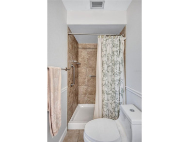 This elegant home features stunning hardwood floors throughout on Highland Lakes Executive Golf Course in Florida - for sale on GolfHomes.com, golf home, golf lot