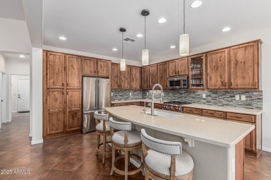 Stunning cul-de-sac home with golf cart garage in Tuscany Falls! on Tuscany Falls At Pebble Creek in Arizona - for sale on GolfHomes.com, golf home, golf lot