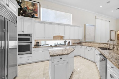 This stunning and meticulously maintained two-story courtyard on Country Club At Mirasol in Florida - for sale on GolfHomes.com, golf home, golf lot