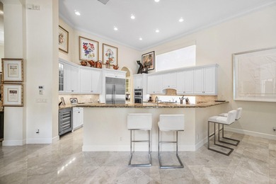 This stunning and meticulously maintained two-story courtyard on Country Club At Mirasol in Florida - for sale on GolfHomes.com, golf home, golf lot