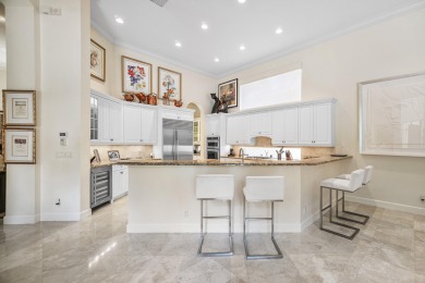 This stunning and meticulously maintained two-story courtyard on Country Club At Mirasol in Florida - for sale on GolfHomes.com, golf home, golf lot