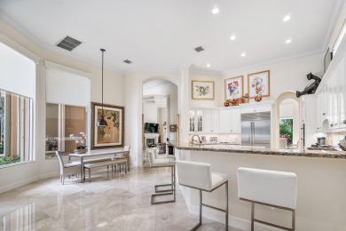 This stunning and meticulously maintained two-story courtyard on Country Club At Mirasol in Florida - for sale on GolfHomes.com, golf home, golf lot