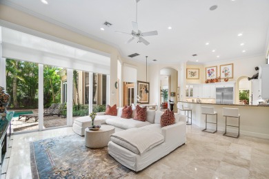 This stunning and meticulously maintained two-story courtyard on Country Club At Mirasol in Florida - for sale on GolfHomes.com, golf home, golf lot