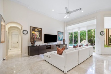 This stunning and meticulously maintained two-story courtyard on Country Club At Mirasol in Florida - for sale on GolfHomes.com, golf home, golf lot