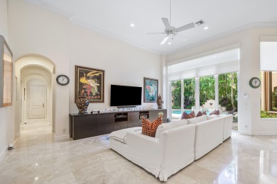 This stunning and meticulously maintained two-story courtyard on Country Club At Mirasol in Florida - for sale on GolfHomes.com, golf home, golf lot