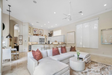 This stunning and meticulously maintained two-story courtyard on Country Club At Mirasol in Florida - for sale on GolfHomes.com, golf home, golf lot