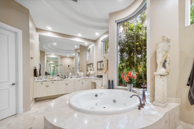 This stunning and meticulously maintained two-story courtyard on Country Club At Mirasol in Florida - for sale on GolfHomes.com, golf home, golf lot