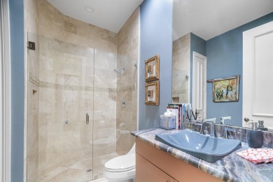 This stunning and meticulously maintained two-story courtyard on Country Club At Mirasol in Florida - for sale on GolfHomes.com, golf home, golf lot