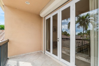 This stunning and meticulously maintained two-story courtyard on Country Club At Mirasol in Florida - for sale on GolfHomes.com, golf home, golf lot