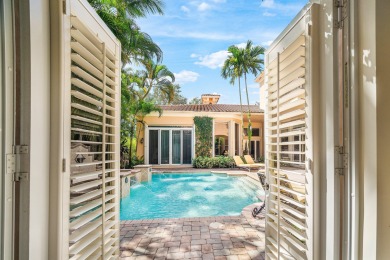 This stunning and meticulously maintained two-story courtyard on Country Club At Mirasol in Florida - for sale on GolfHomes.com, golf home, golf lot