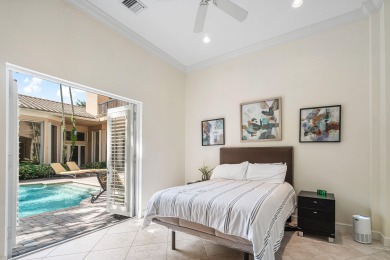 This stunning and meticulously maintained two-story courtyard on Country Club At Mirasol in Florida - for sale on GolfHomes.com, golf home, golf lot