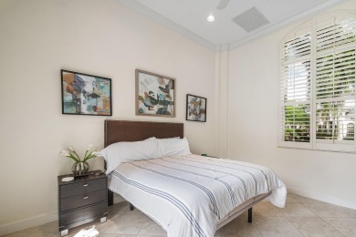 This stunning and meticulously maintained two-story courtyard on Country Club At Mirasol in Florida - for sale on GolfHomes.com, golf home, golf lot