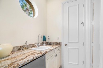 This stunning and meticulously maintained two-story courtyard on Country Club At Mirasol in Florida - for sale on GolfHomes.com, golf home, golf lot