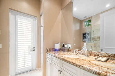 This stunning and meticulously maintained two-story courtyard on Country Club At Mirasol in Florida - for sale on GolfHomes.com, golf home, golf lot