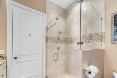 This stunning and meticulously maintained two-story courtyard on Country Club At Mirasol in Florida - for sale on GolfHomes.com, golf home, golf lot